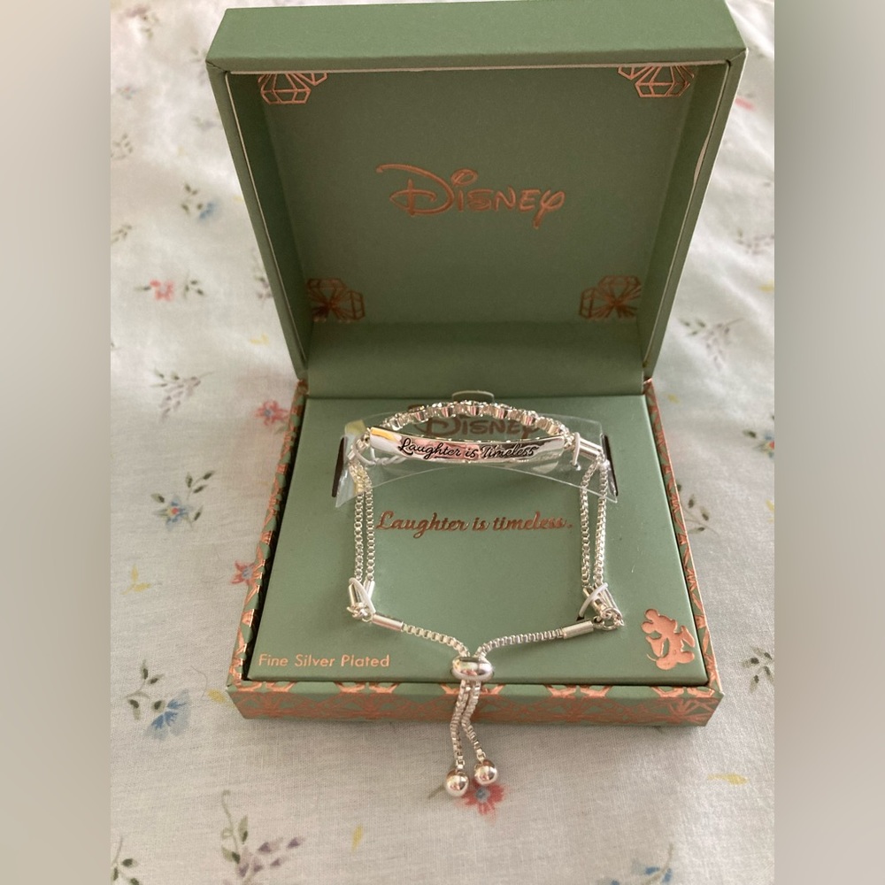 Brand New Disney bracelet ( laughter is timeless with Mickey head)
